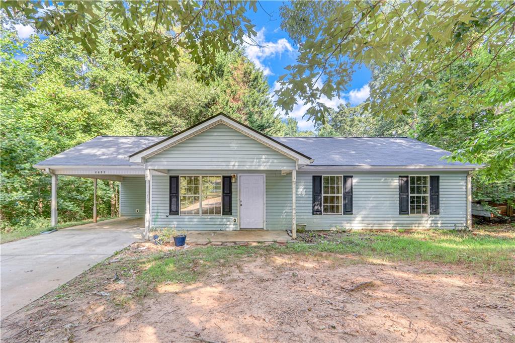 5780 Riley Farm Road Lula, GA 30554 - Photo 1 of 1 a front view of a house with yard and green space