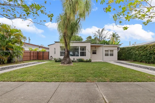 front view of a house with a yard