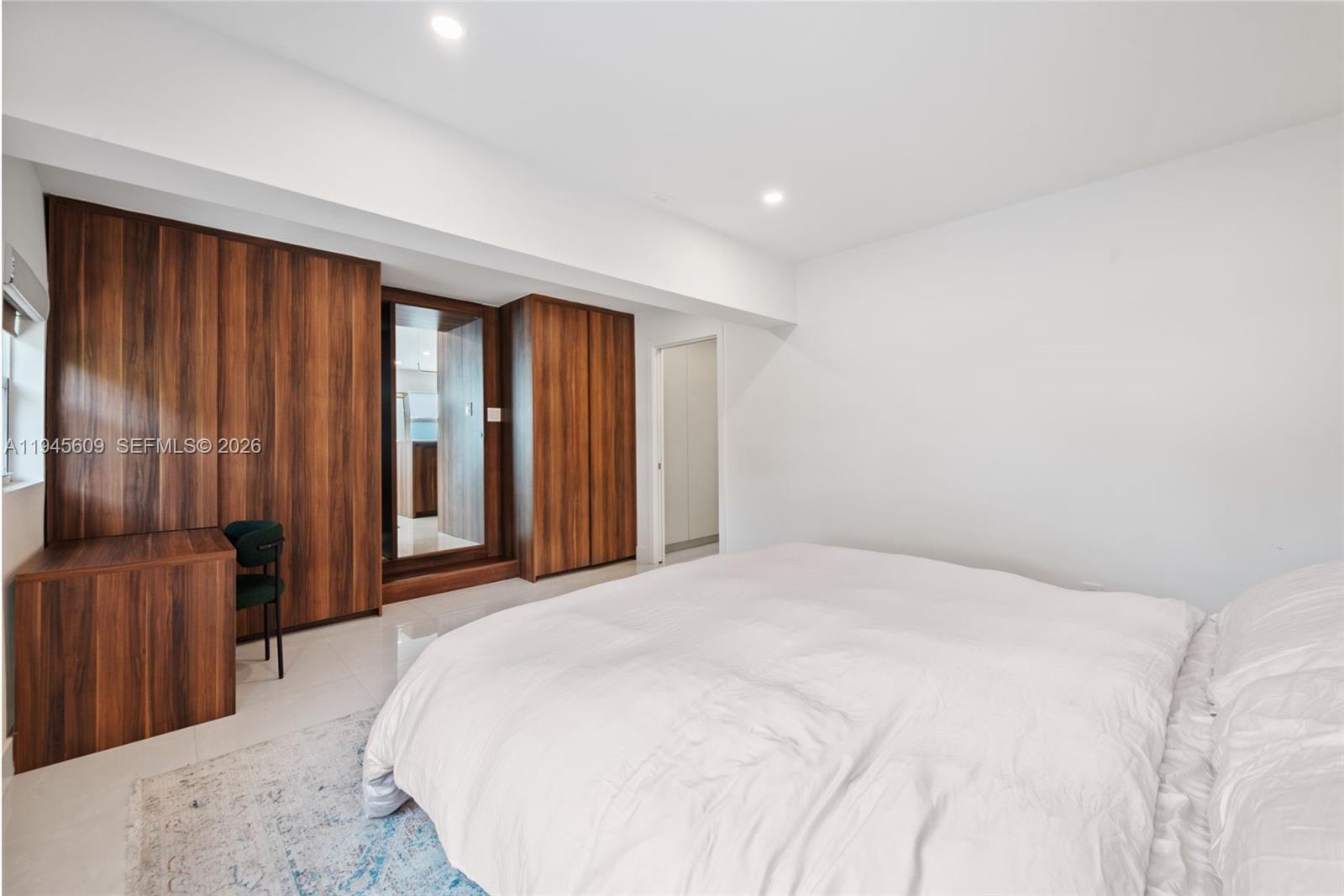 2180 Southwest 20th Street Miami, FL 33145 - Photo 15 of 25 a spacious bedroom with a bed and cabinets