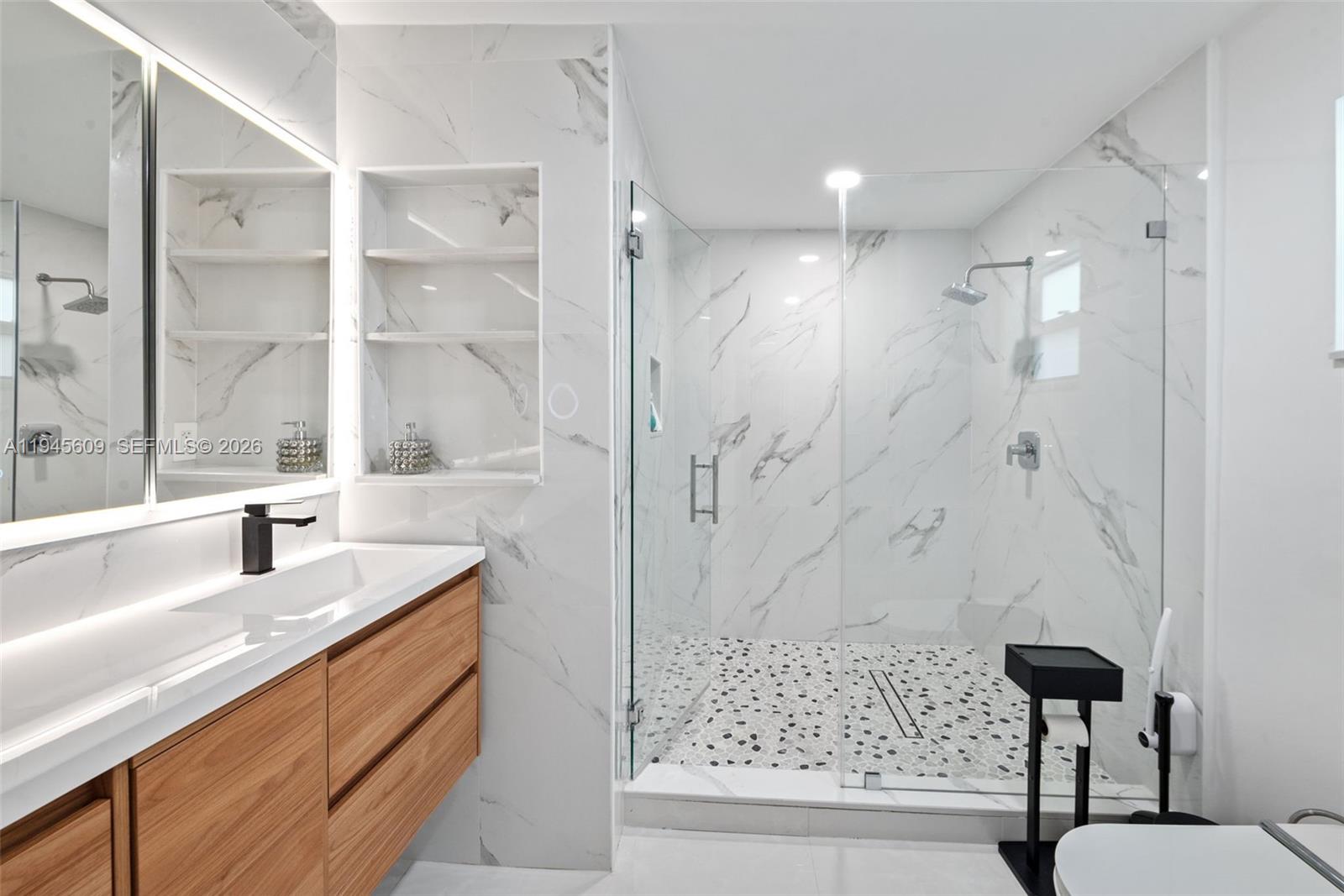 2180 Southwest 20th Street Miami, FL 33145 - Photo 16 of 25 a bathroom with a granite countertop sink a toilet and shower