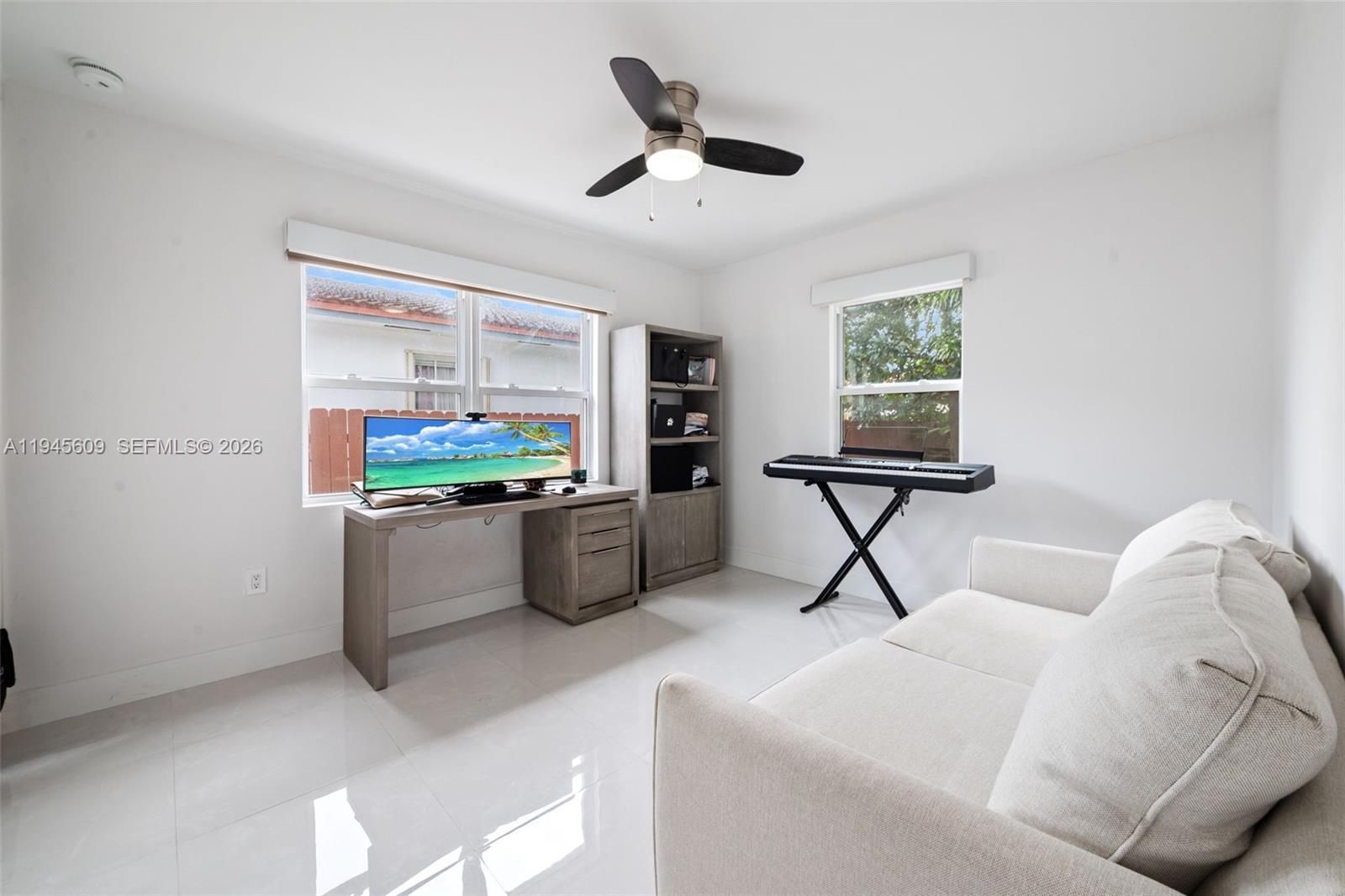 2180 Southwest 20th Street Miami, FL 33145 - Photo 17 of 25 a living room with furniture and a flat screen tv