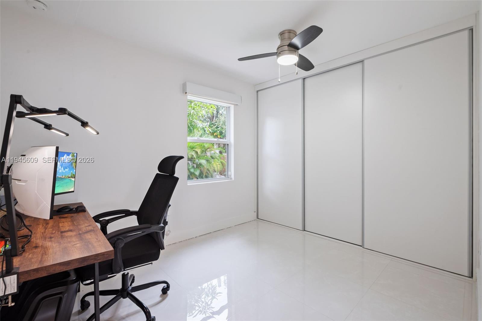 2180 Southwest 20th Street Miami, FL 33145 - Photo 18 of 25 a view of a workspace with furniture and a window