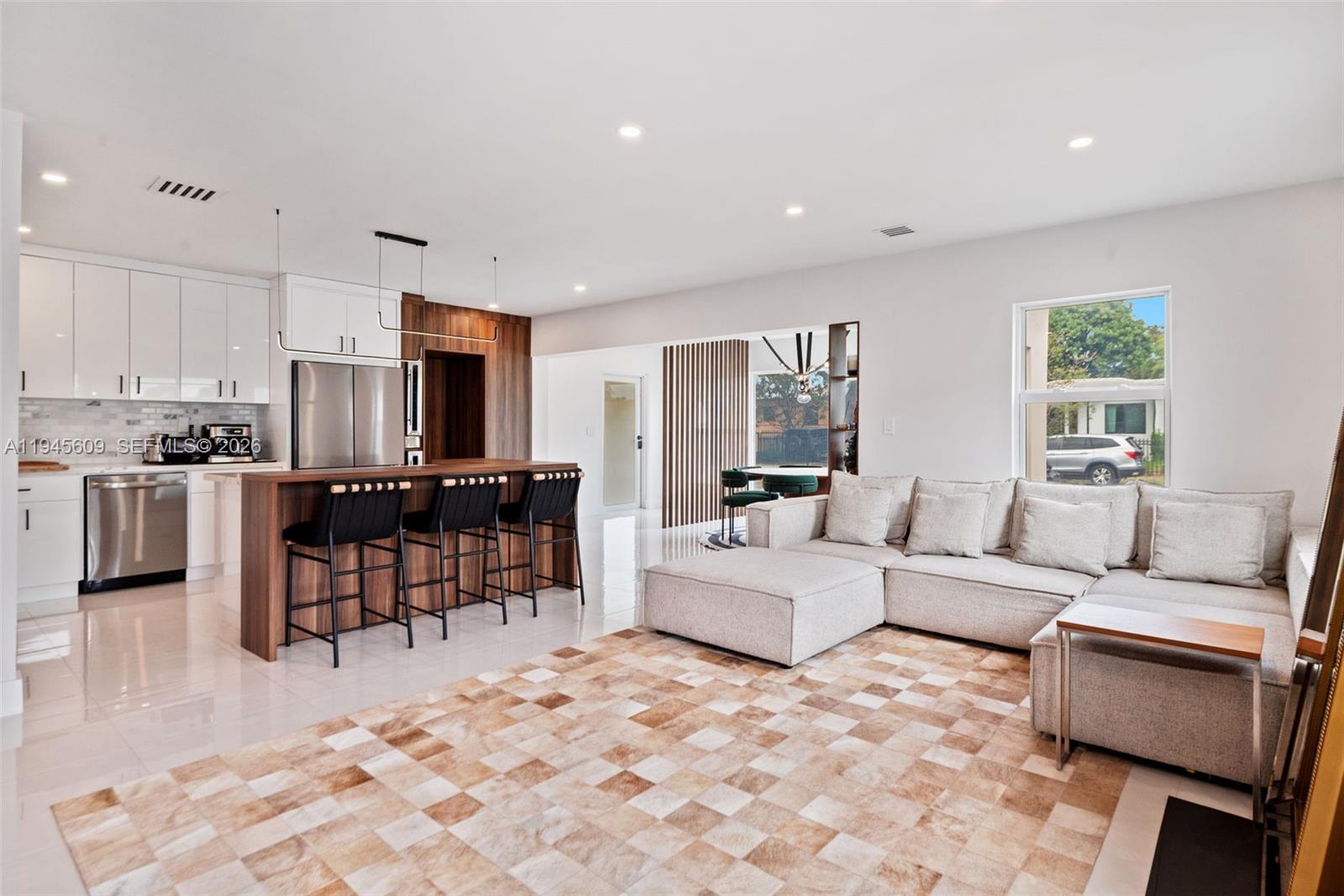 2180 Southwest 20th Street Miami, FL 33145 - Photo 6 of 25 a living room with furniture and kitchen view