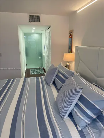 a view of a living room and bathroom