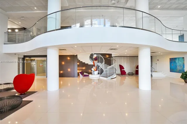 an aerial view of a house yard and ocean view