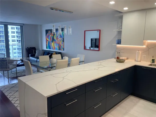 a en suite bathroom with a double vanity sink and a mirror