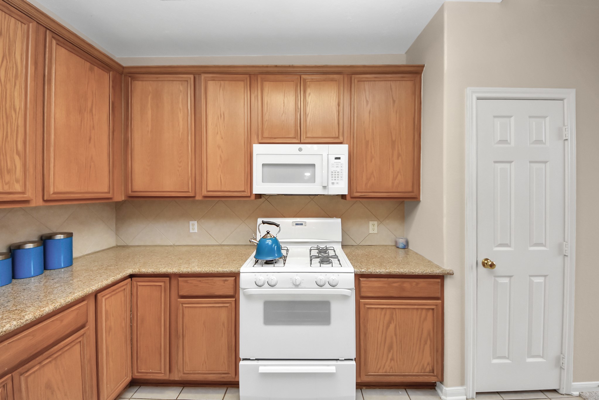 18963 Candlelight Crescent Road Spring, TX 77388 - Photo 15 of 33 Kitchen offers ample cabinet storage, spacious walk-in pantry, and a gas stove - ideal for everyday cooking and entertaining.