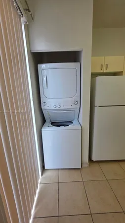 a kitchen with stainless steel appliances a refrigerator sink and cabinets