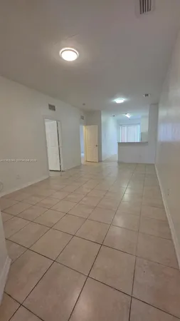 a view of an empty room and window