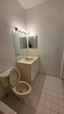 a bathroom with a toilet and a sink