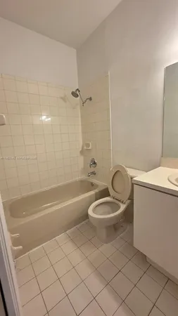 a bathroom with a toilet a sink and bathtub
