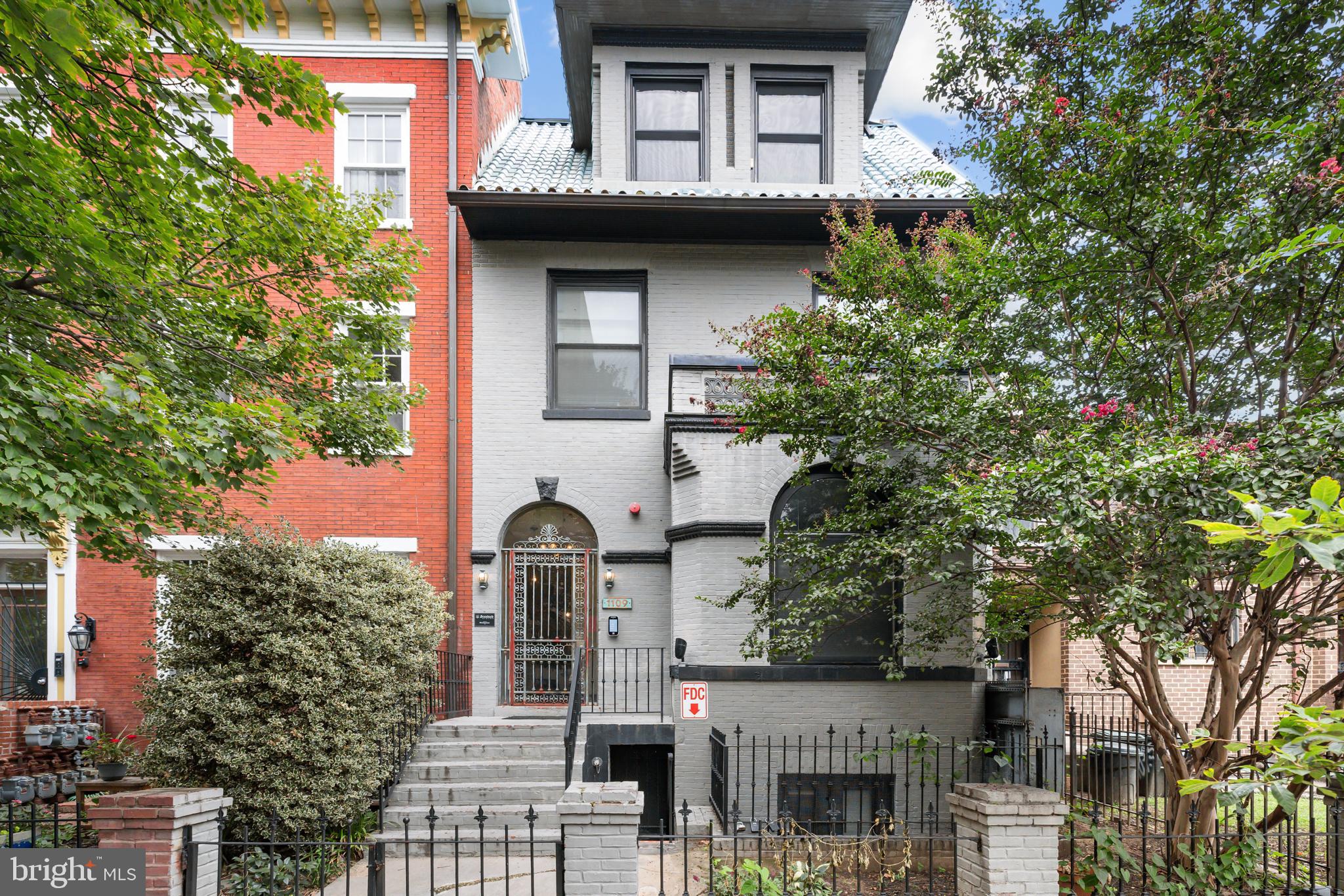 1109 M Street Northwest, Unit 1 Washington, DC 20005 - Photo 1 of 32 a front view of a house with garden