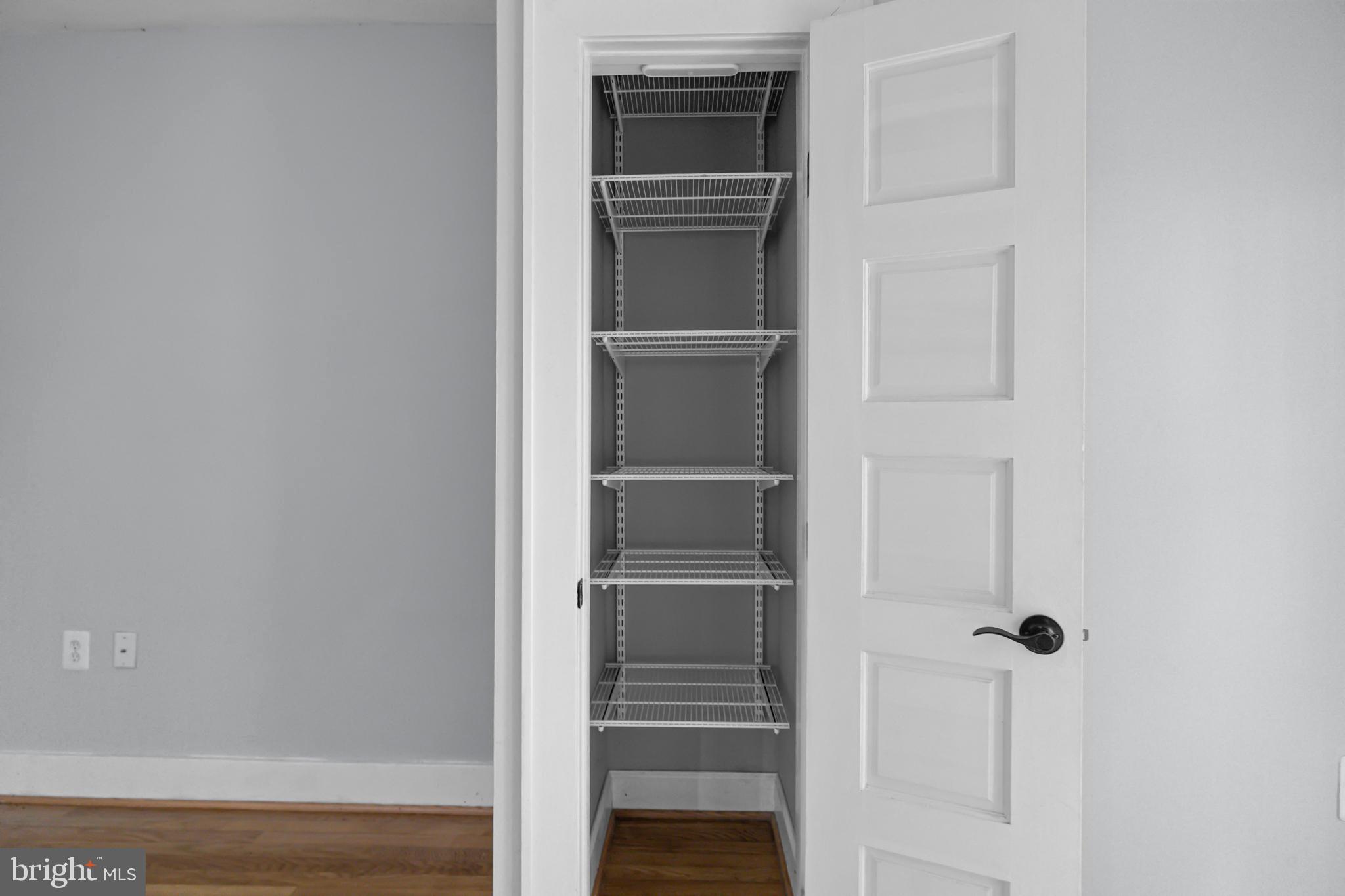 1109 M Street Northwest, Unit 1 Washington, DC 20005 - Photo 11 of 32 a view of a room with rack on the wall