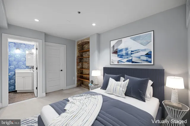 an empty room with closet and bathroom