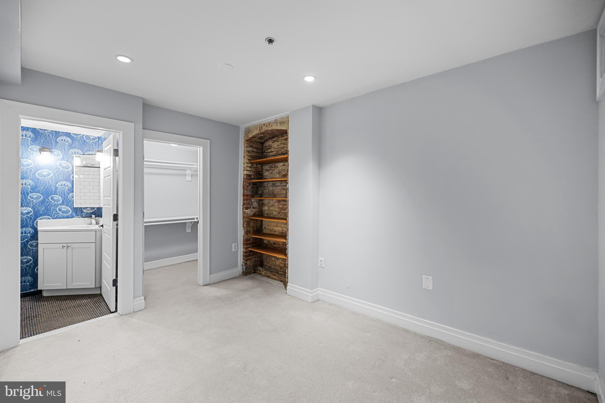 1109 M Street Northwest, Unit 1 Washington, DC 20005 - Photo 22 of 32 an empty room with a kitchen