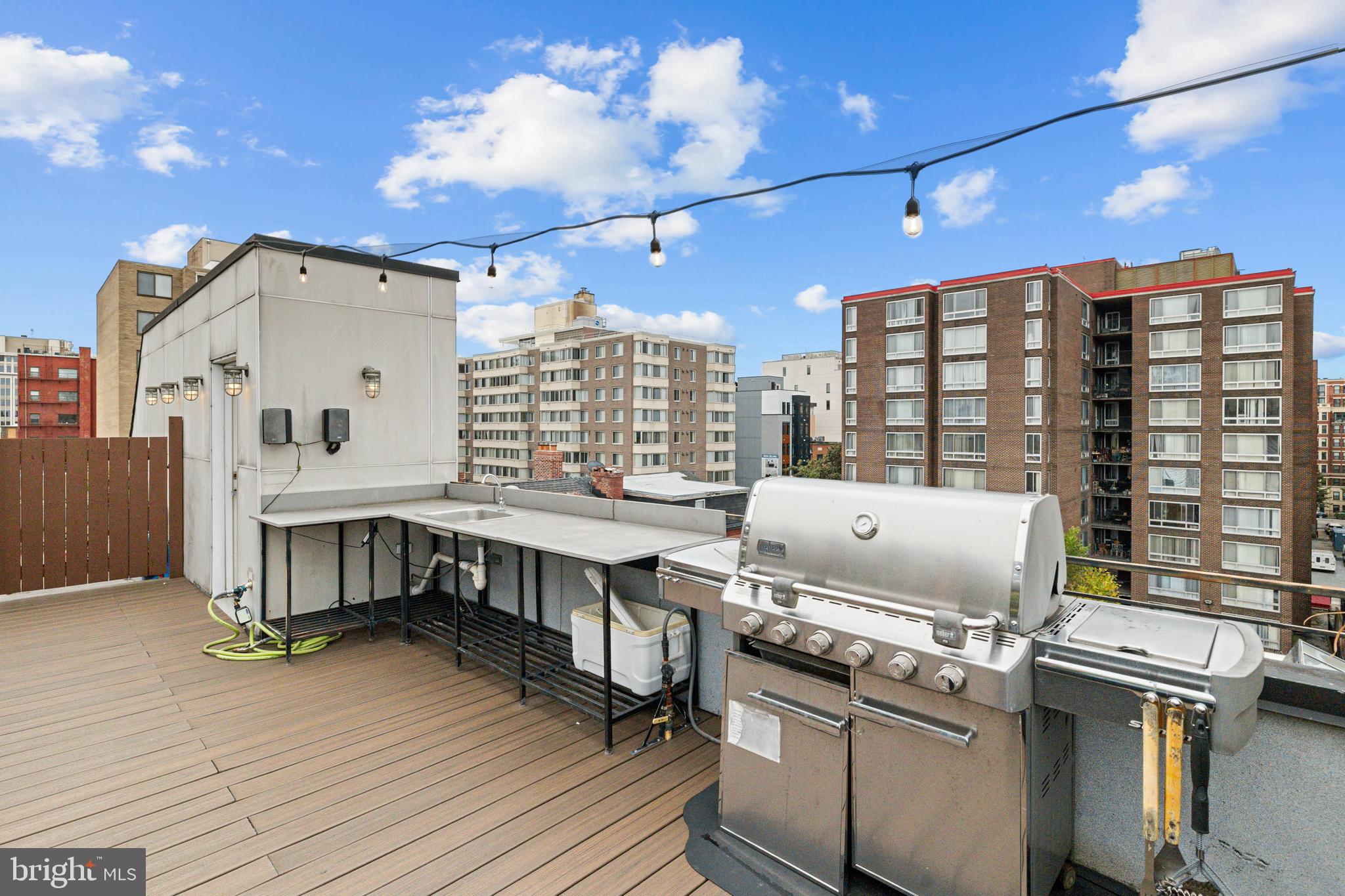 1109 M Street Northwest, Unit 1 Washington, DC 20005 - Photo 29 of 32 a kitchen with a stove and a refrigerator