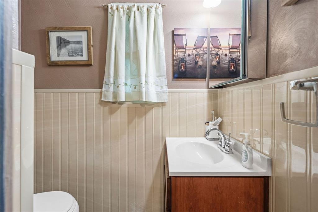 4768 Rolling Hills Road Pittsburgh, PA 15236 - Photo 17 of 46 a bathroom with a sink toilet and mirror