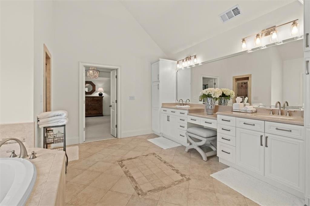 1002 Tyle Street Northwest Kennesaw, GA 30152 - Photo 35 of 83 a spacious bathroom with a double vanity sink mirror and
