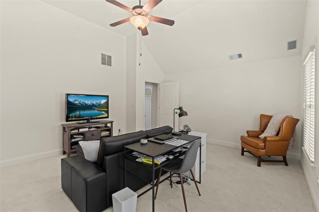 1002 Tyle Street Northwest Kennesaw, GA 30152 - Photo 45 of 83 a living room with furniture and a flat screen tv