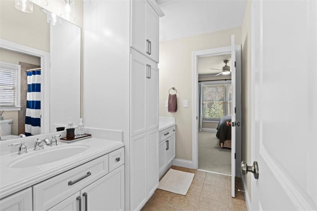 1002 Tyle Street Northwest Kennesaw, GA 30152 - Photo 47 of 83 a spacious bathroom with a double vanity sink a mirror and shower