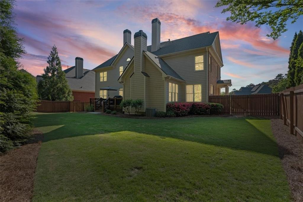 1002 Tyle Street Northwest Kennesaw, GA 30152 - Photo 63 of 83 a front view of a house with a garden and plants