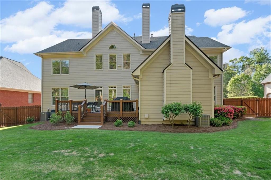 1002 Tyle Street Northwest Kennesaw, GA 30152 - Photo 64 of 83 a front view of house with yard and outdoor seating