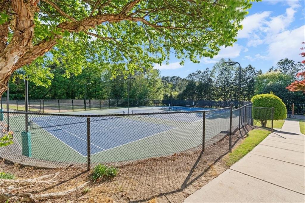 1002 Tyle Street Northwest Kennesaw, GA 30152 - Photo 75 of 83 a view of a swimming pool with a patio and a yard