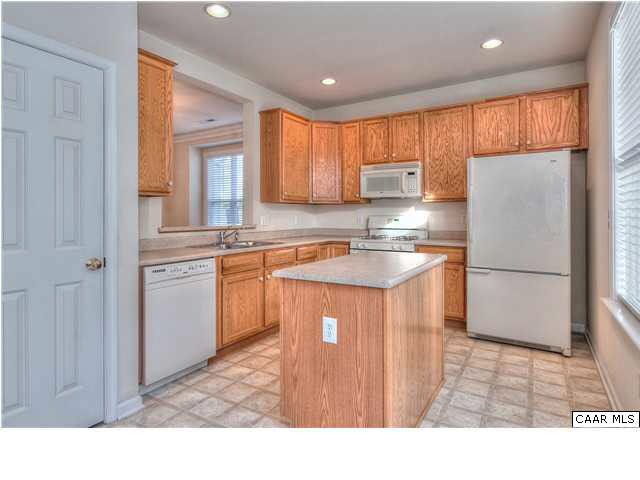 1357 Stoney Ridge Road Charlottesville, VA 22902 - Photo 2 of 10 a kitchen with kitchen island a sink stainless steel appliances and cabinets