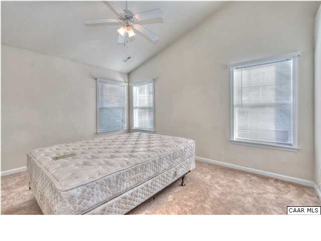 1357 Stoney Ridge Road Charlottesville, VA 22902 - Photo 6 of 10 a bedroom with a bed and a chandelier