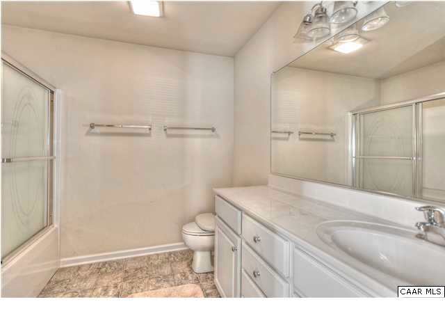 1357 Stoney Ridge Road Charlottesville, VA 22902 - Photo 7 of 10 a bathroom with a sink toilet vanity and shower