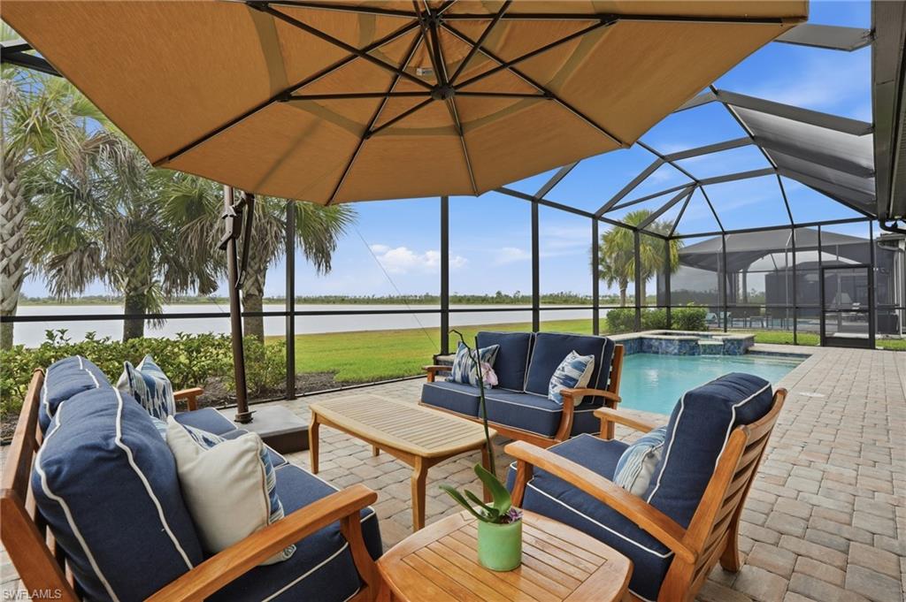 19696 Aqua View Lane Fort Myers, FL 33913 - Photo 39 of 50 a view of an outdoor sitting area with furniture and umbrella