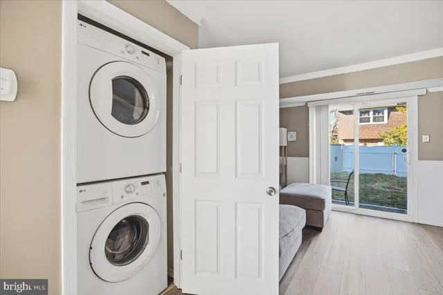 a view of a hallway with washer and dryer