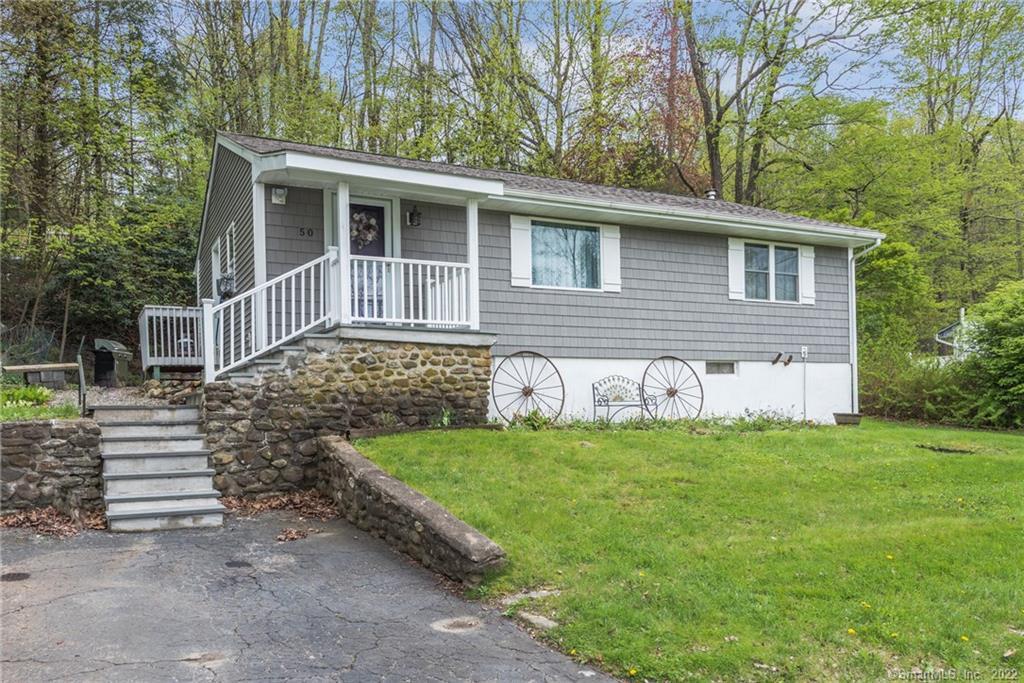 50 Spring Trail Newtown, CT 06482 - Photo 1 of 1 a front view of a house with a yard
