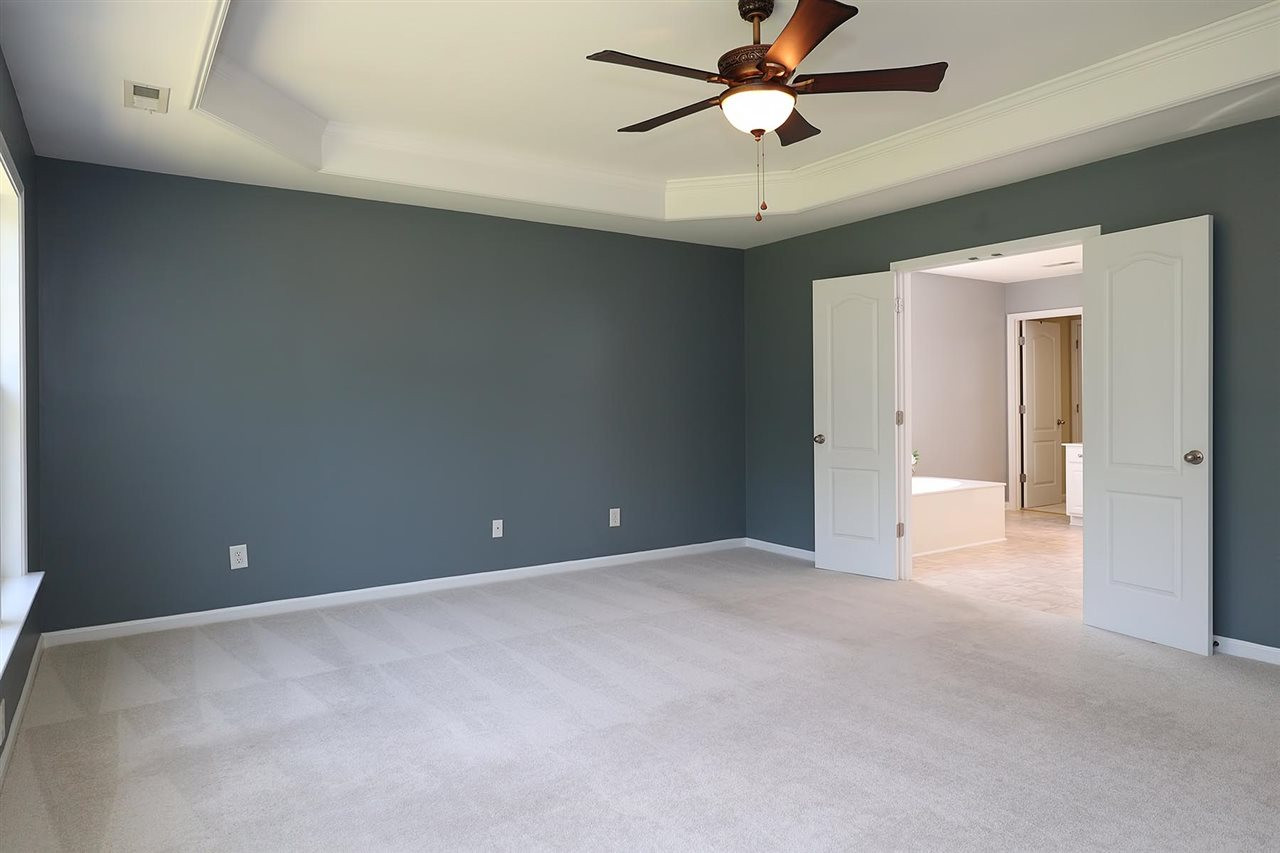 7616 Vista Del Rey Lane Raleigh, NC 27613 - Photo 15 of 25 an empty room and chandelier fan
