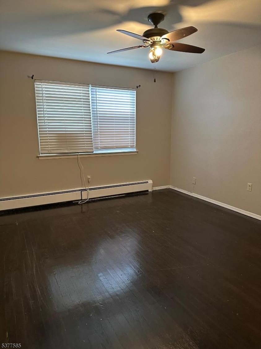 1143 Valley Road, Unit 1143 Wayne, NJ 07470 - Photo 18 of 25 a view of an empty room with a window