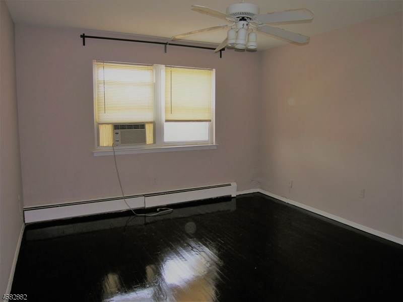 1143 Valley Road, Unit 1143 Wayne, NJ 07470 - Photo 19 of 25 an empty room with a window