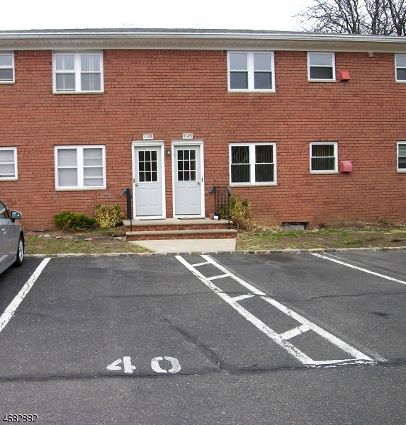 1143 Valley Road, Unit 1143 Wayne, NJ 07470 - Photo 2 of 25 a view of a house with a patio