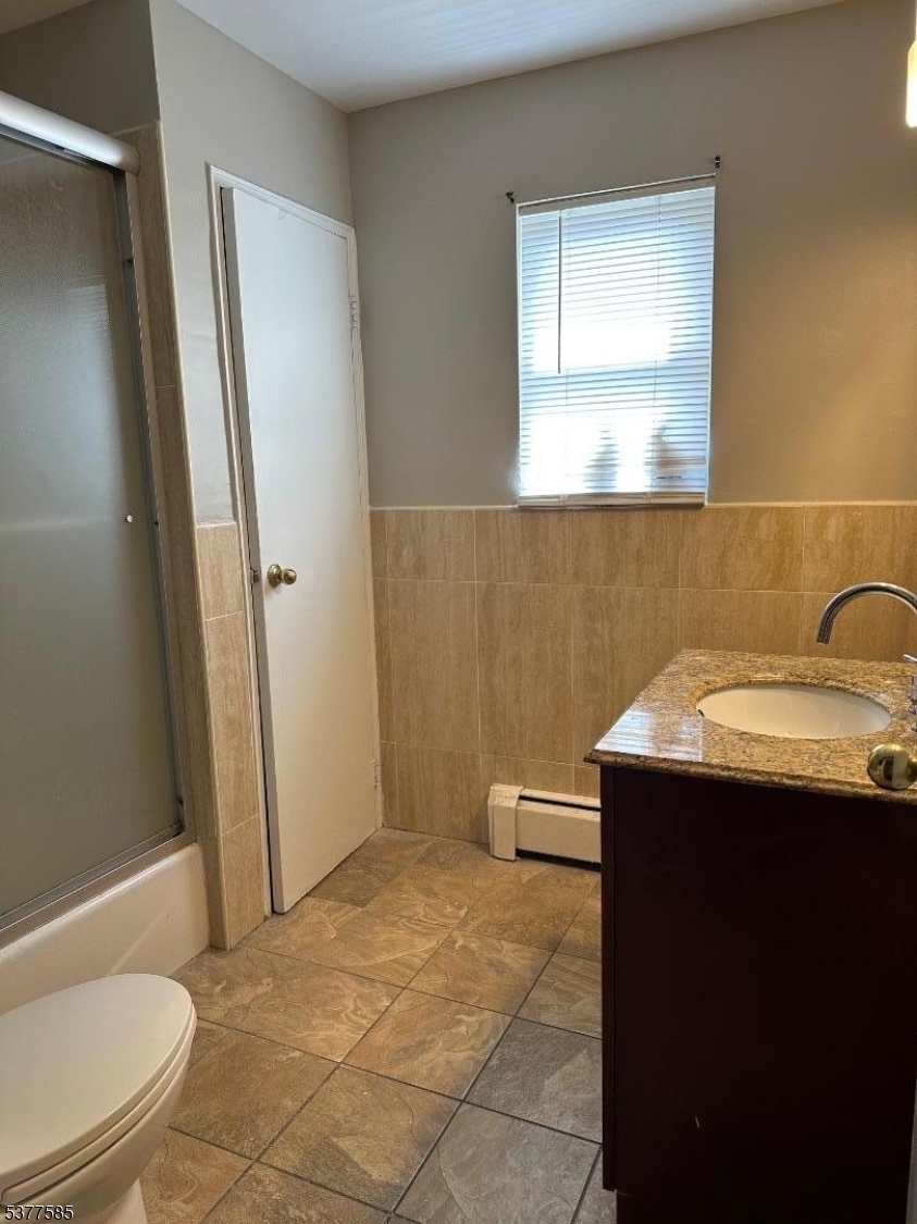 1143 Valley Road, Unit 1143 Wayne, NJ 07470 - Photo 21 of 25 a bathroom with a sink a toilet and shower