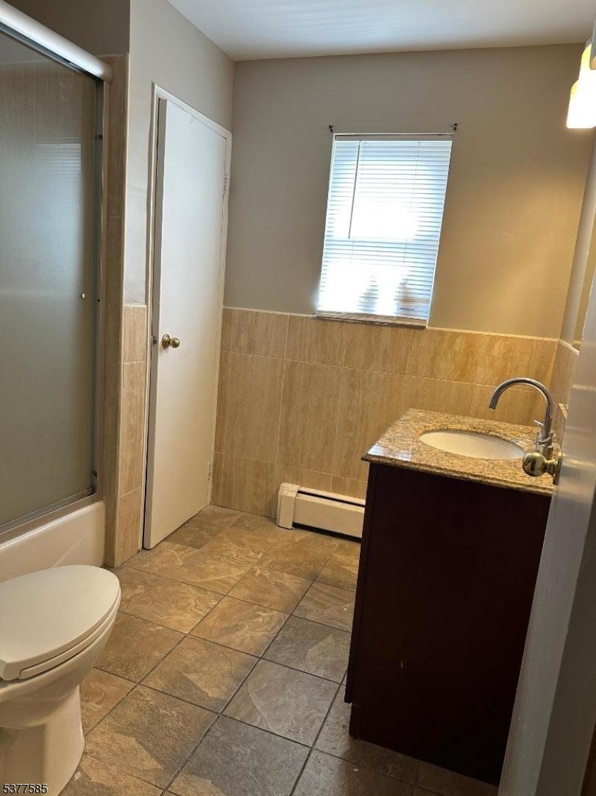 1143 Valley Road, Unit 1143 Wayne, NJ 07470 - Photo 22 of 25 a bathroom with a sink a toilet and shower