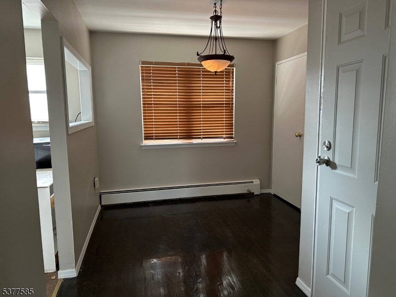1143 Valley Road, Unit 1143 Wayne, NJ 07470 - Photo 7 of 25 a view of an empty room with a window