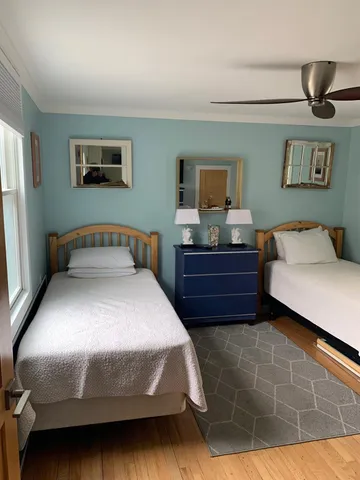 a bedroom with a bed and a night stand
