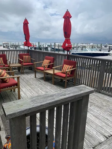 a view of balcony with wooden floor