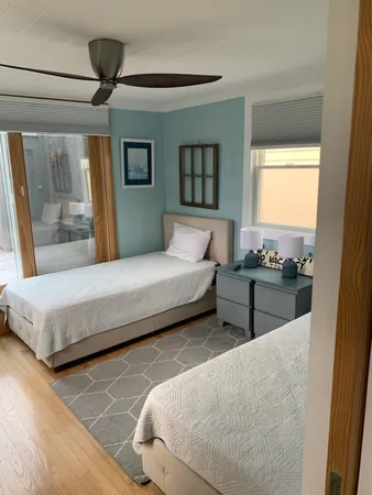 a bedroom with a large bed and a window