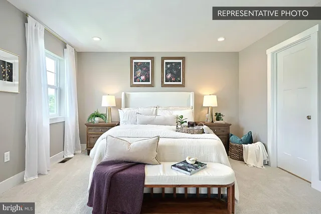 a living room with furniture and a dresser