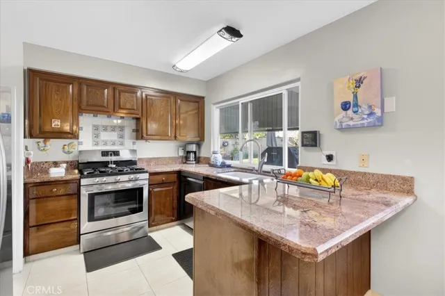 a kitchen with a stove and a sink