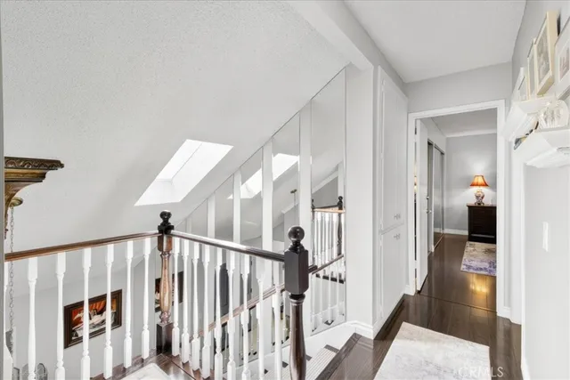 a living room with furniture a mirror and a toilet