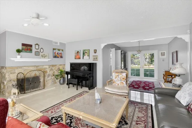 a living room with furniture and a fireplace