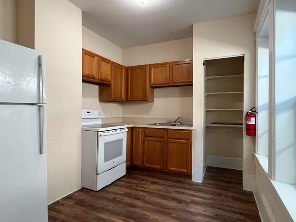 a kitchen with a refrigerator stove and a sink