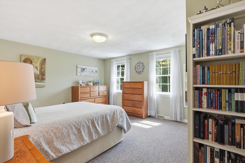 9 Fazio Farm Road Georgetown, MA 01833 - Photo 28 of 42 a bedroom with a bed and a book shelf
