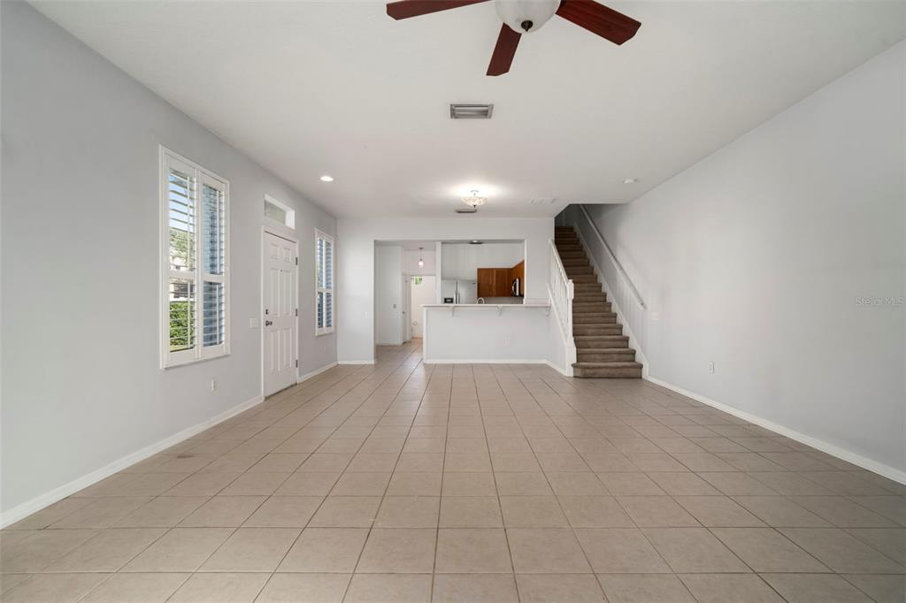 2802 Conch Hollow Drive Brandon, FL 33511 - Photo 16 of 74 en empty room with windows and ceiling fan